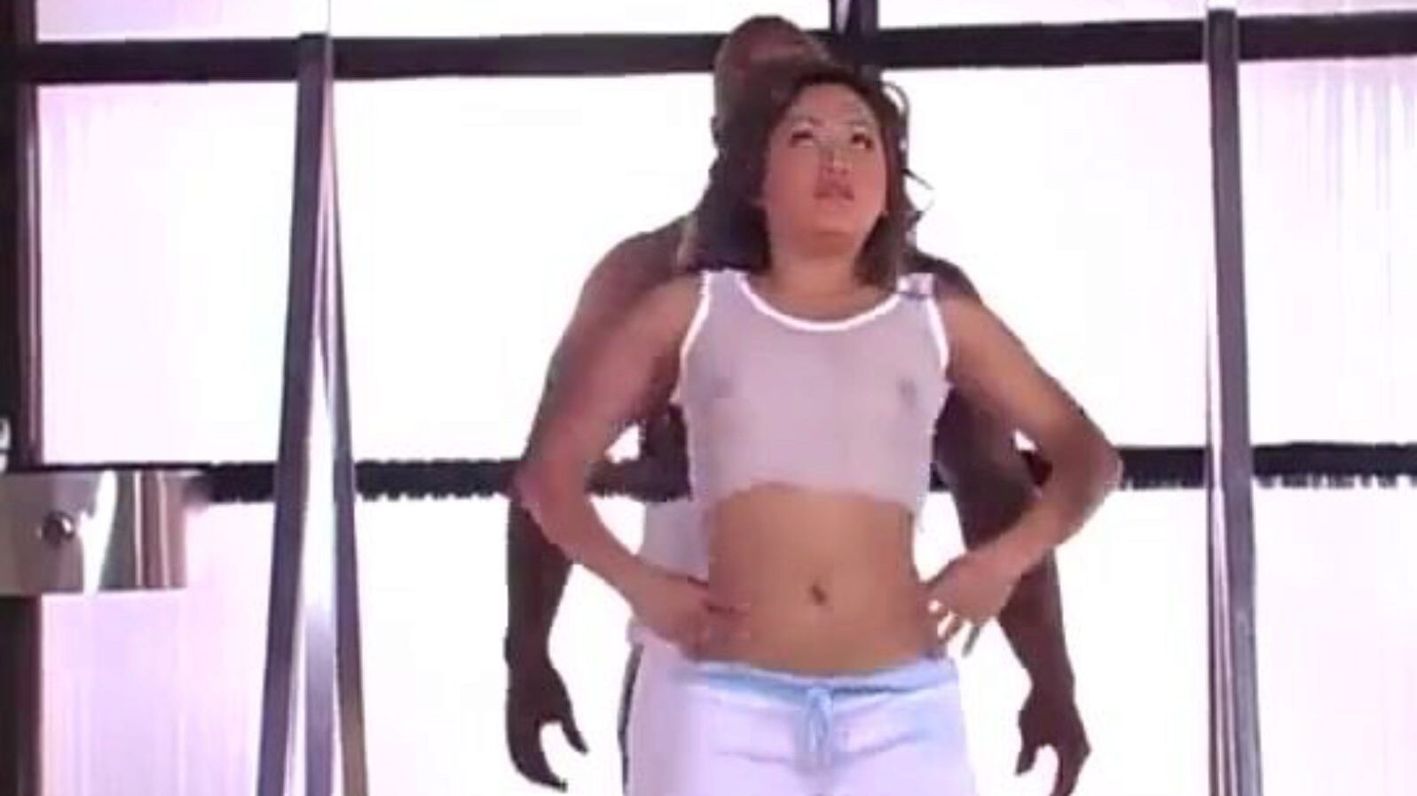 Sabrine Maui is bending and stretching during her